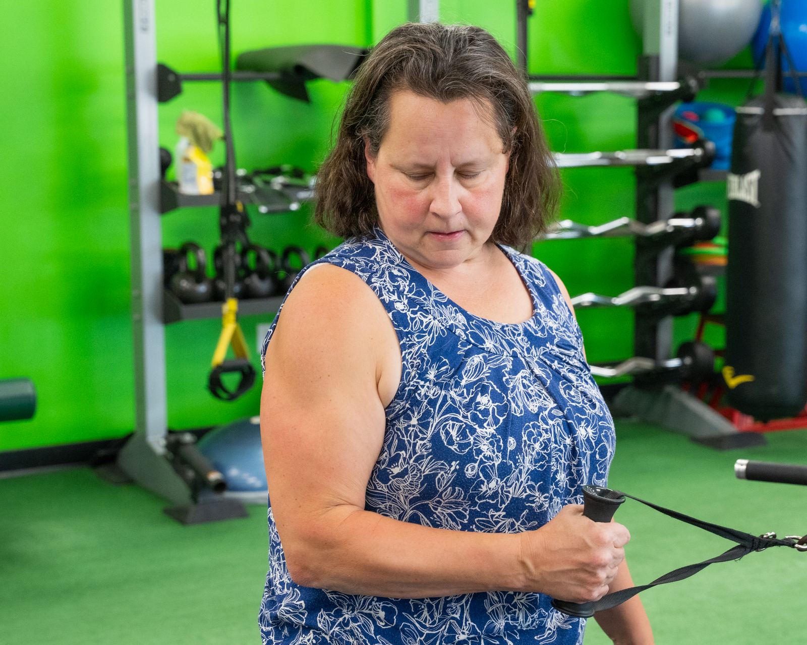 Client performing strength training at Redefine Fitness