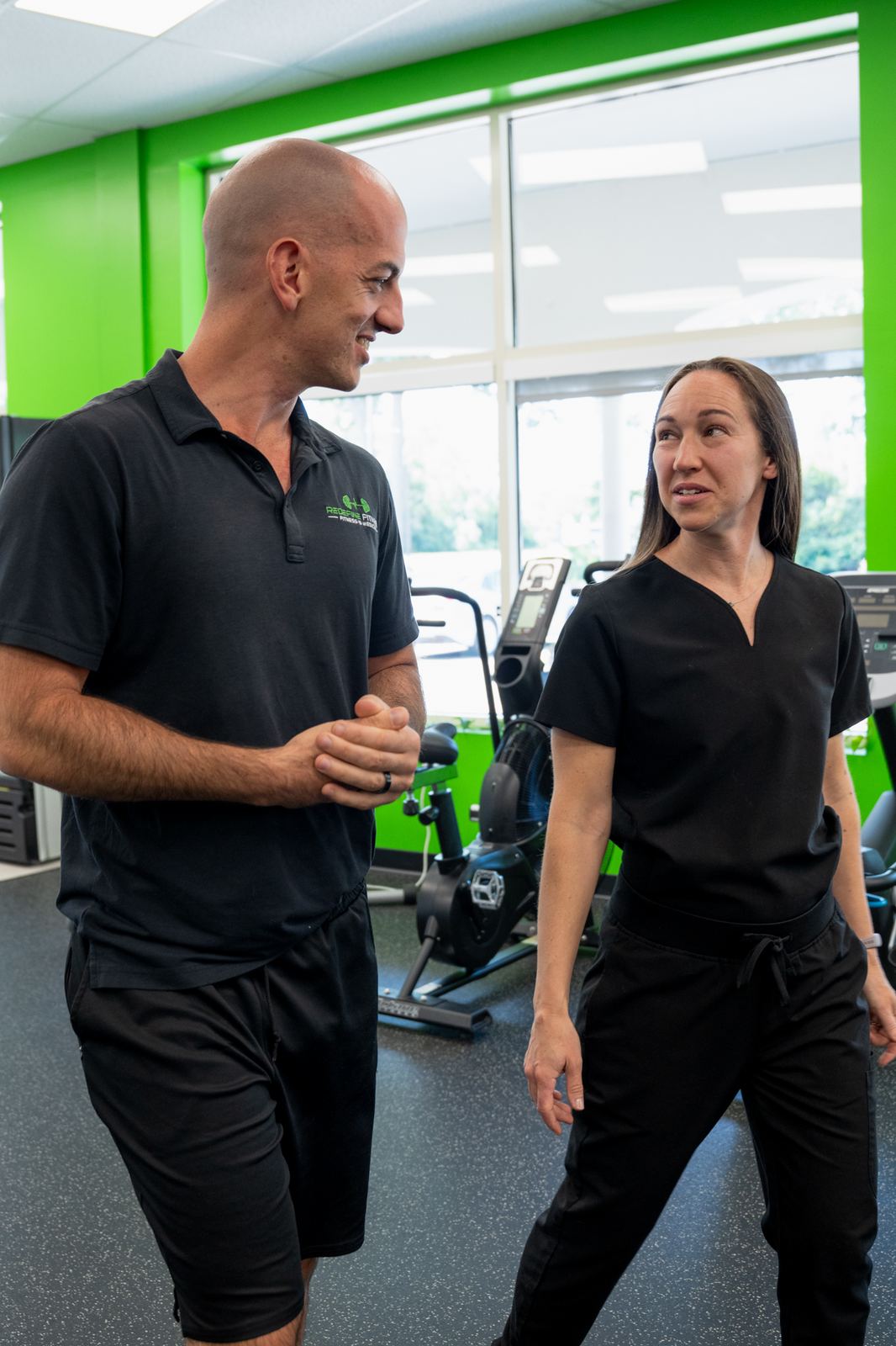 Clinical Advisor Amanda Teeple, NP and founder Anthony Amen on the Redefine Fitness training floor