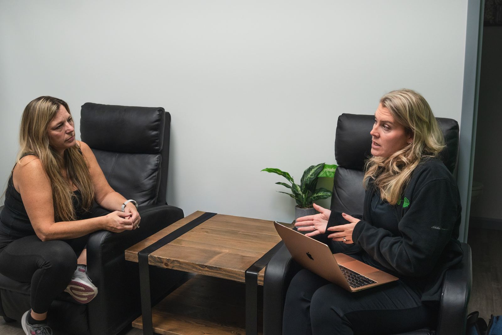 Fitness Specialist and a new client talking through goals and health history at Redefine Fitness