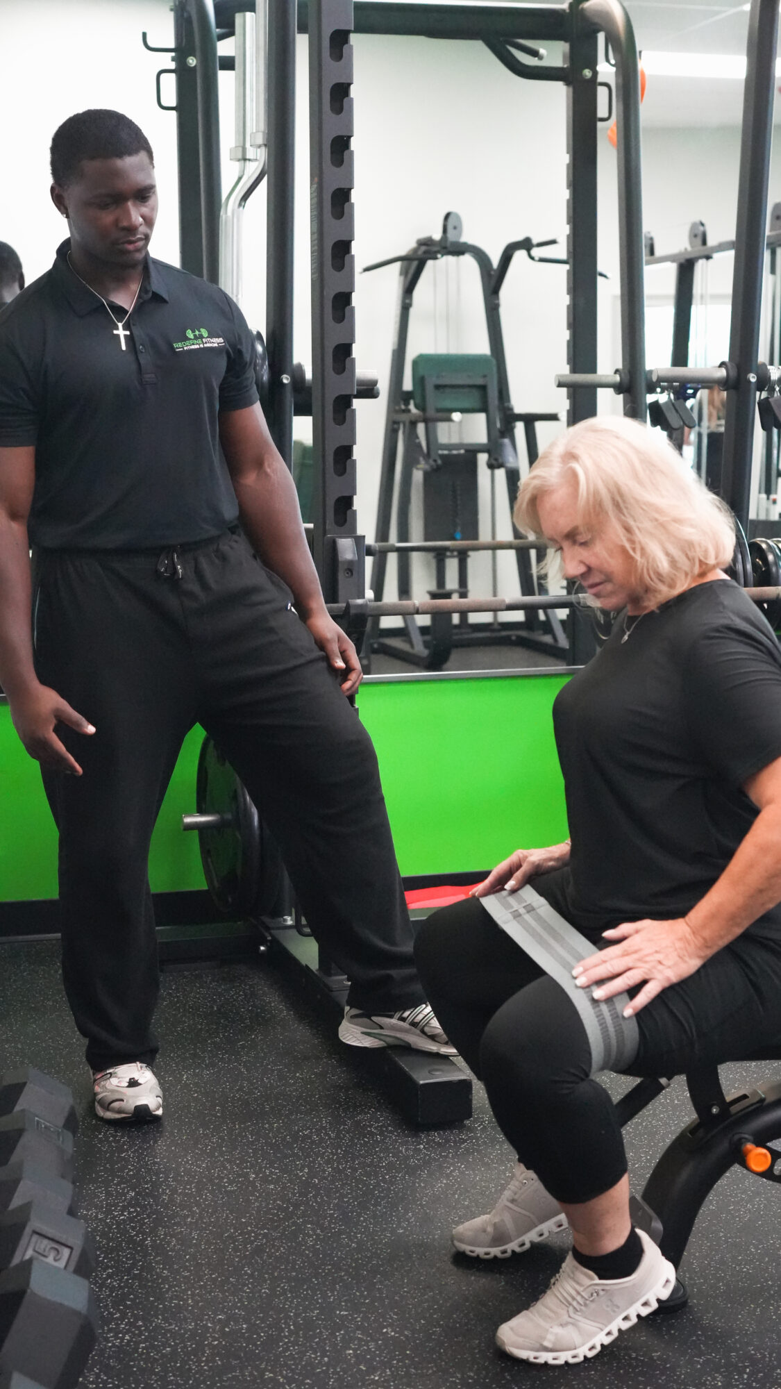 Fitness Specialist reviewing a client’s screening results with her